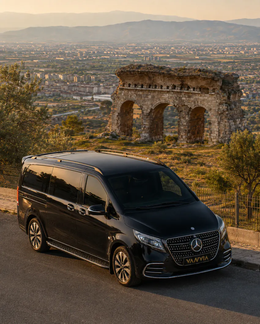 Mercedes-Benz Vito VIP beside ancient Roman arch ruins overlooking the Aydın plain for an Izmir Airport Aydin transfer