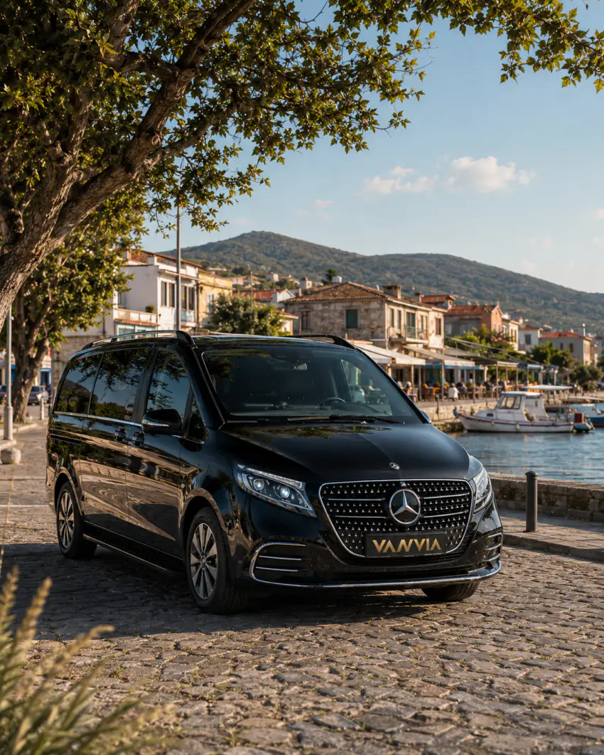 Black Mercedes-Benz Vito VIP waiting on the Küçükkuyu waterfront road ahead of an airport transfer