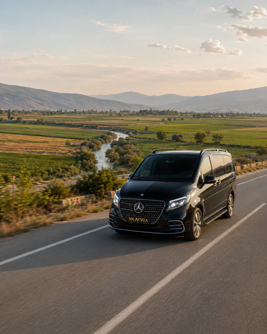Mercedes-Benz Vito VIP driving a riverside road through farmland