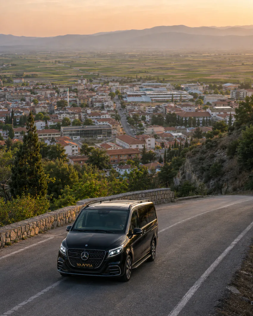 Mercedes-Benz Vito VIP on a hillside road overlooking a valley town for an Izmir Airport Soke transfer